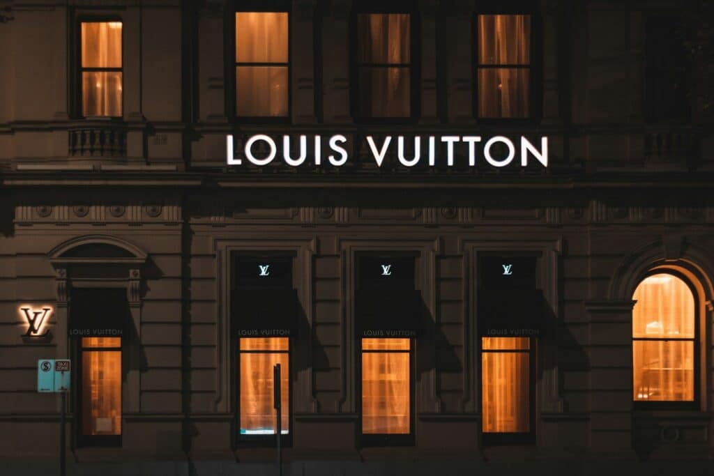 Louis Vuitton - brown wooden door with glass