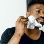 Grooming's Hidden Health Cost - men's black crew-neck shirt